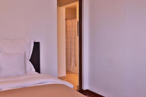 Ένα ή περισσότερα κρεβάτια σε δωμάτιο στο Ola Boutique Hotel