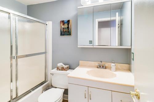 a bathroom with a toilet and a sink and a shower at Screened Patio, Deck and Grill Saint Inigoes Home! in Saint Inigoes Shores