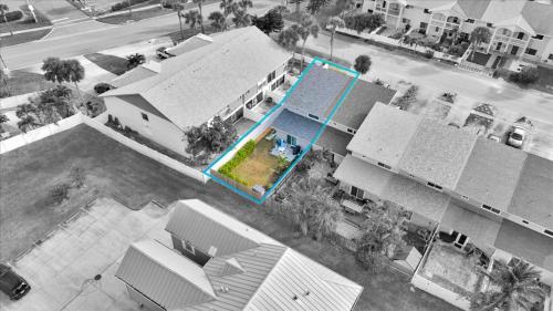 an aerial view of a house with a swimming pool at Beach House Retreat in Cape Canaveral
