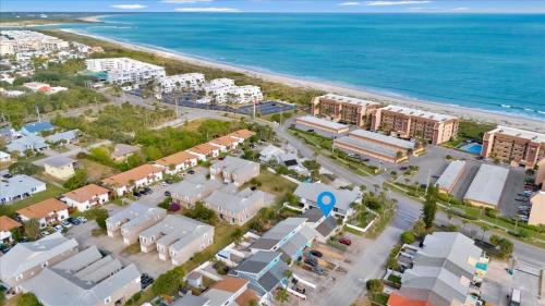 an aerial view of a resort next to the beach at Beach House Retreat in Cape Canaveral