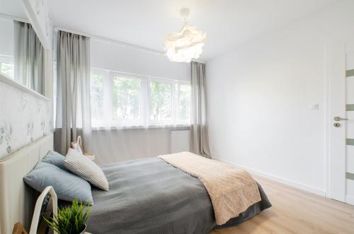Ένα ή περισσότερα κρεβάτια σε δωμάτιο στο Apartament Tatrzańska