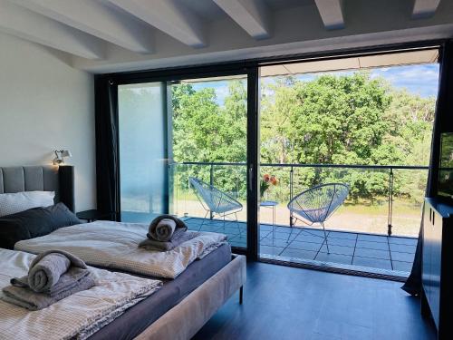 Ένα ή περισσότερα κρεβάτια σε δωμάτιο στο Ferienwohnung FischerLoft im Haus Hiddensee Prora