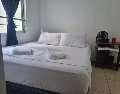 Ένα ή περισσότερα κρεβάτια σε δωμάτιο στο Gualanday Apartamento Valle del Lili