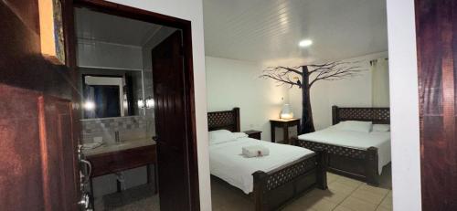 Katil atau katil-katil dalam bilik di Hotel Pacande B&B