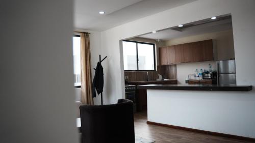a kitchen with a counter top in a room at San Benito B&B cerca Quito Aeropuerto - Tumbaco in Tumbaco