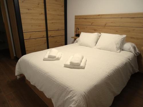 Ένα ή περισσότερα κρεβάτια σε δωμάτιο στο El Mirador del Marqués