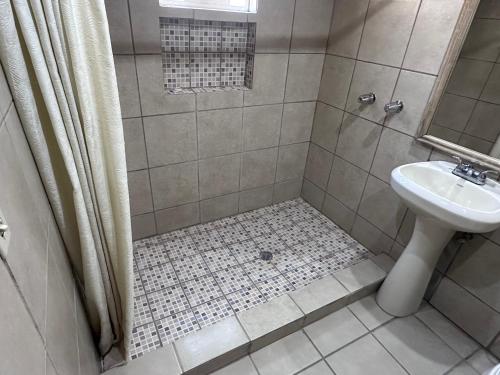 a bathroom with a sink and a toilet and a shower at Condominio 1 in San Felipe