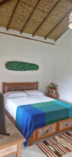 Ένα ή περισσότερα κρεβάτια σε δωμάτιο στο Bangalô do Lago