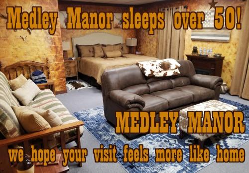 a living room with a couch and a bed at Medley Manor in Creve Coeur