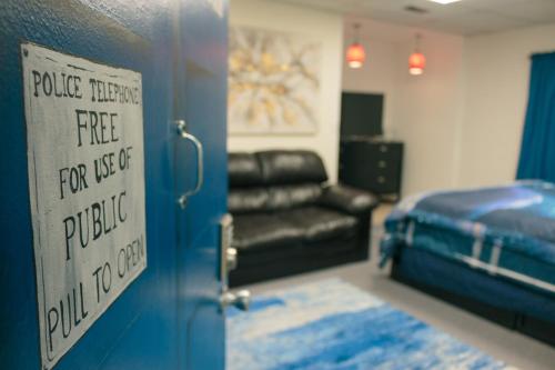 a room with a door with a sign that readspolice mercy for ease of public at Medley Manor in Creve Coeur