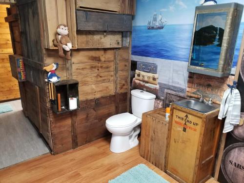 a bathroom with a toilet and a sink at Medley Manor in Creve Coeur