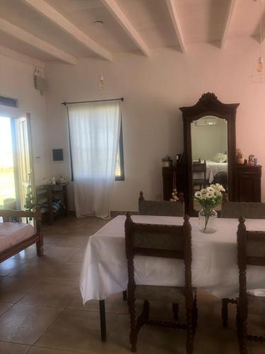a living room with a table and a mirror at A Morriña in Santa Lucía