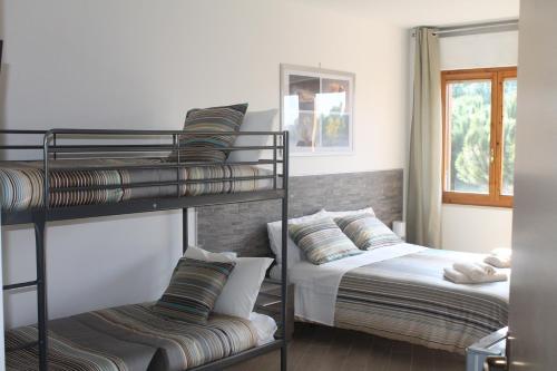Posteľ alebo postele v izbe v ubytovaní "VACANZA A CASA" - Gallicano & Gallicano2