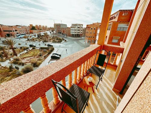 a balcony of a building with a view of a street at Residence Chay - Luxury Appart in Ouarzazate