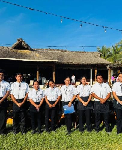 a group of men in shirts and ties posing for a picture at Oceanfront Casa Rhino in Paso Hondo