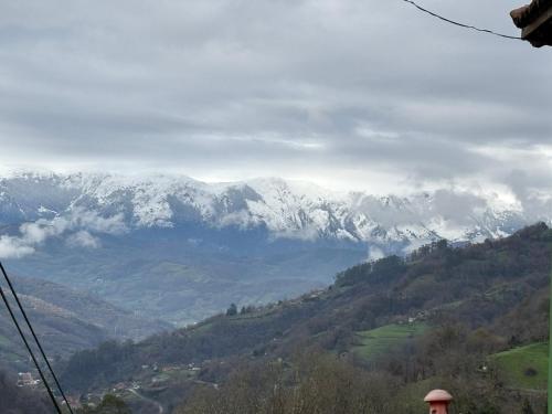 a view of a mountain range with snow covered mountains at Casa Milu in Armiello