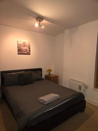 Postel nebo postele na pokoji v ubytování Cosy 2 bedroom apartment