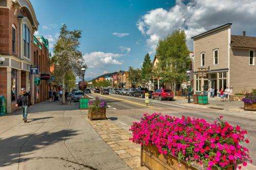 a street in a small town with pink flowers at Rockridge 59 by Summit County Mountain Retreats in Breckenridge