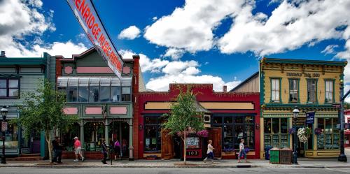 a group of buildings on a city street at Rockridge 41 by Summit County Mountain Retreats in Breckenridge