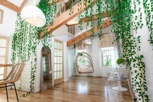 a room with a wall covered in ivy at Light filled zen 3BR Penthouse - 7 min to Westport in Weston