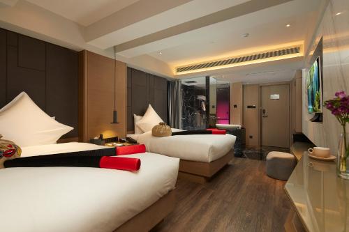 Postel nebo postele na pokoji v ubytování Mercure Yangzhou Dongguan Street