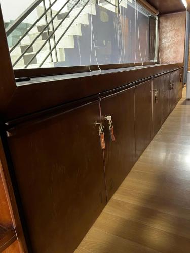 a room with a wooden door with a window at Xuân Home in Trai Mat