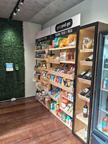 a grocery store aisle with shelves of food at Excluído por Problemas !! in Campinas