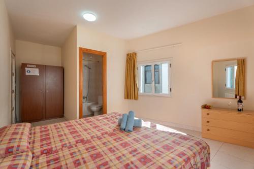 a hotel room with a bed and a bathroom at Hotel Germán in Vilaflor