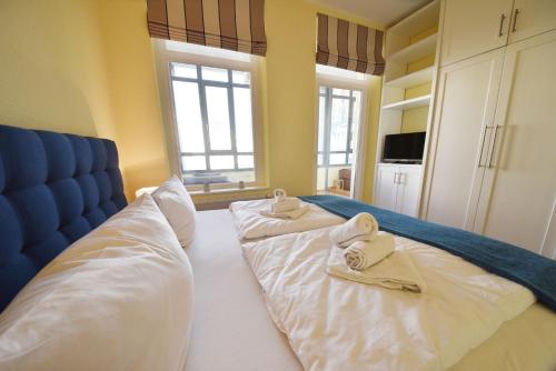 Кровать или кровати в номере Ferienwohnung "Seestern" in der Villa Odin Sellin