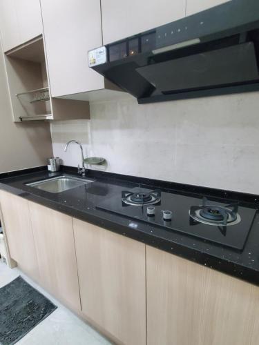 Η κουζίνα ή μικρή κουζίνα στο AFFAN Homestay near PICC & Putrajaya Lake