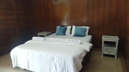 Postel nebo postele na pokoji v ubytování Blue Laguna Inn