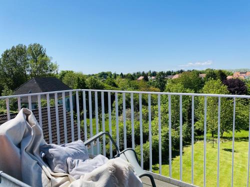 a bed on a balcony with a view at Ferienwohnung Circus Loft in der Villa Circus Putbus in Putbus