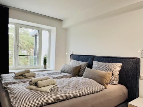 a bedroom with two beds with pillows on them at Ferienwohnung Ruhepol im Haus Zudar Prora in Binz