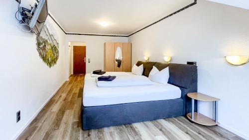a bedroom with a large white bed and a table at Smart Resorts B&B 2 BB2 321 in Winterberg