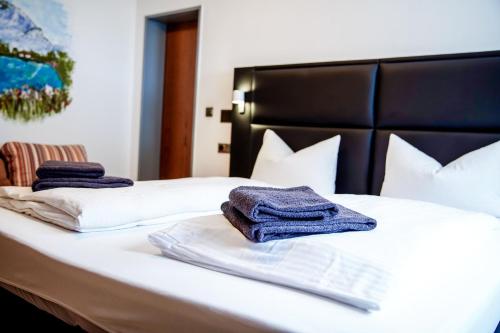 a bed with towels sitting on top of it at Smart Resorts B&B 2 BB2 324 in Winterberg