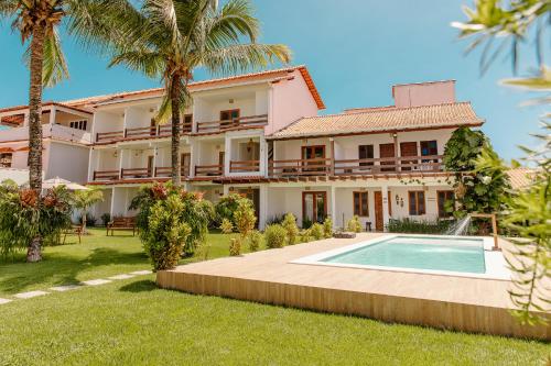 an image of a house with a swimming pool at Casa Dela Pousada in Cabo Frio