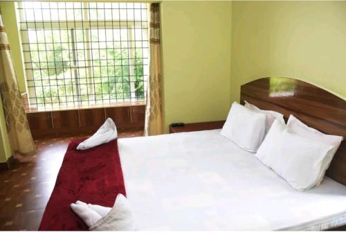 Postel nebo postele na pokoji v ubytování Coorg hill crest family room