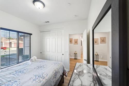 a bedroom with a bed and a large window at Charming Pet-Friendly Getaway in Sunny Beaumont home in Beaumont