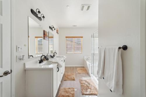 a white bathroom with a sink and a mirror at Charming Pet-Friendly Getaway in Sunny Beaumont home in Beaumont