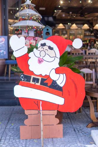 a statue of santa claus on top of a stack at Seahorse Han Market Da Nang Apartment by Haviland in Danang