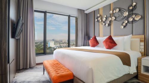 Postel nebo postele na pokoji v ubytování Vasaka Hotel Jakarta Managed by Dafam