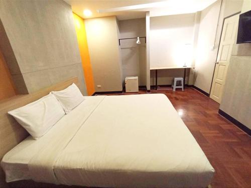 Ένα ή περισσότερα κρεβάτια σε δωμάτιο στο GO INN Silom BTS Surasak สถานีสุรศักดิ์