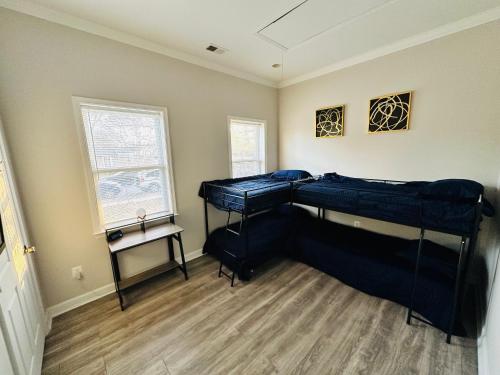 a room with two bunk beds in it at New Oasis by DC in Hyattsville