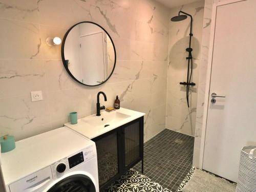 a bathroom with a sink and a washing machine at Maison neuve spacieuse à Groix, proche du Bourg - FR-1-813-4 in Groix