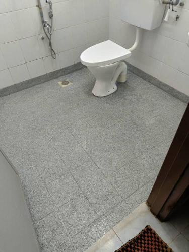 a bathroom with a white toilet in a stall at Nuha Kulim Hitech Homestay Islamic in Kulim