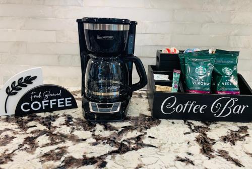 a black blender sitting on a counter with a box of coffee at Travelers Rest Treasure - Sleeps 8 - 3 Bedroom 2 Bath - Pets Welcome in Travelers Rest