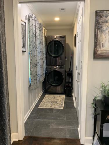 a hallway with a washer and dryer in a house at Travelers Rest Treasure - Sleeps 8 - 3 Bedroom 2 Bath - Pets Welcome in Travelers Rest