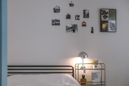 a bedroom with a bed and pictures on the wall at 인천 간석동 머니스테이 in Incheon