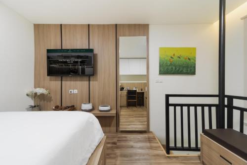 Postel nebo postele na pokoji v ubytování Verdant Bali Tirta Lepang
