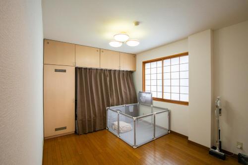 Katil atau katil-katil dalam bilik di Bigstone Terrace suite　堤町